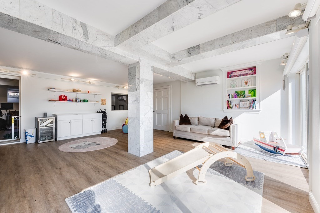 21 Arborough Road Boston, MA 02131 - Photo 30 of 40 a living room with furniture and wooden floor