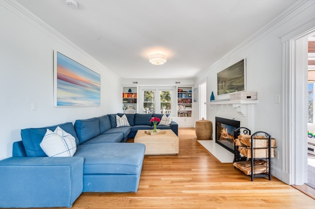 21 Arborough Road Boston, MA 02131 - Photo 3 of 40 a living room with furniture and a fireplace
