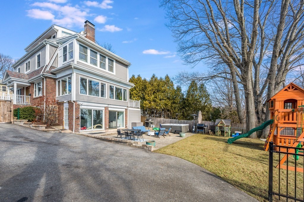21 Arborough Road Boston, MA 02131 - Photo 34 of 40 a row of palm trees in front of a building