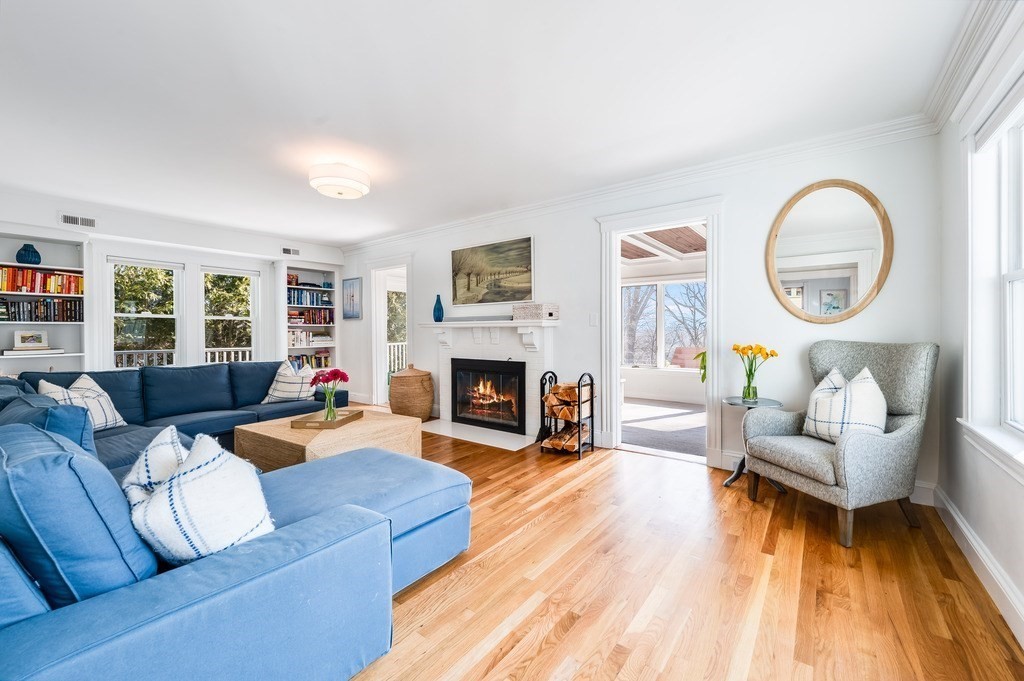 21 Arborough Road Boston, MA 02131 - Photo 4 of 40 a living room with furniture and a fireplace