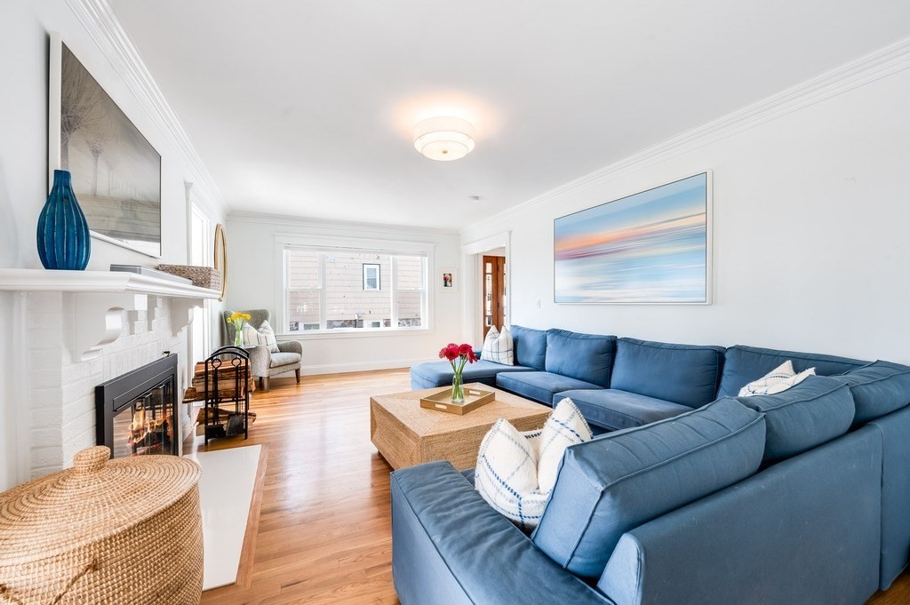 21 Arborough Road Boston, MA 02131 - Photo 5 of 40 a living room with fireplace furniture and a wooden floor