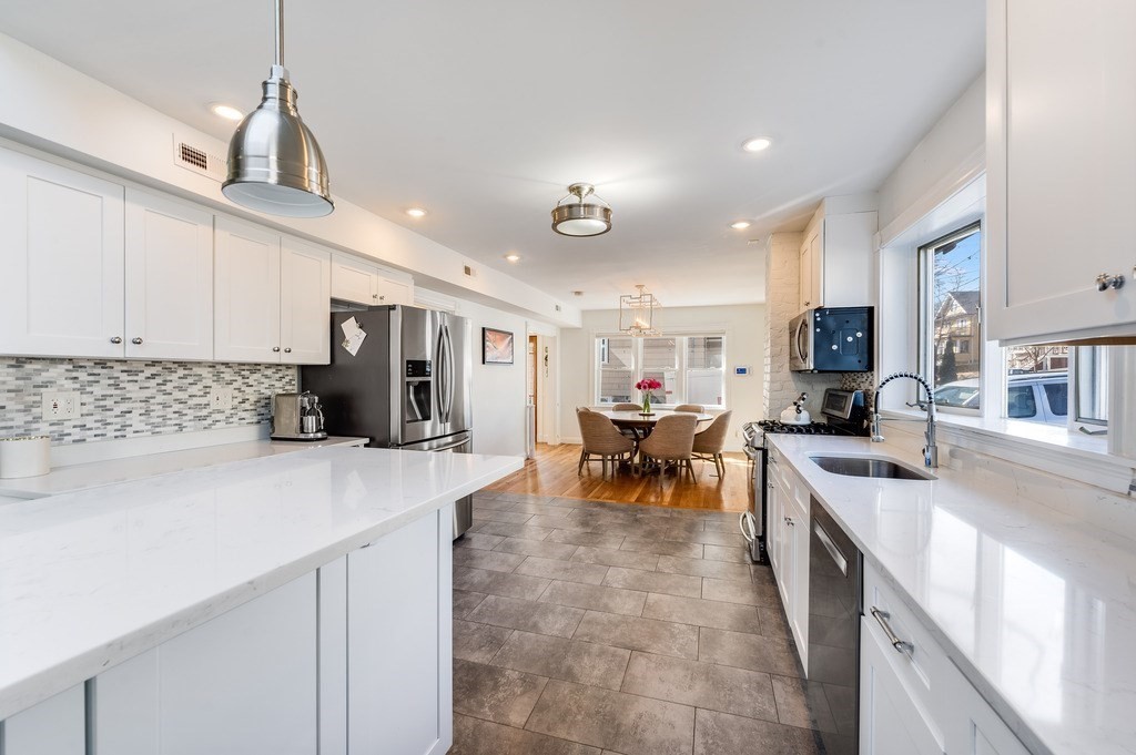 21 Arborough Road Boston, MA 02131 - Photo 10 of 40 a kitchen with stainless steel appliances lots of counter top space