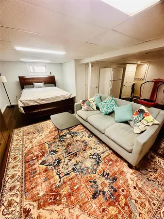 a living room with furniture and a rug