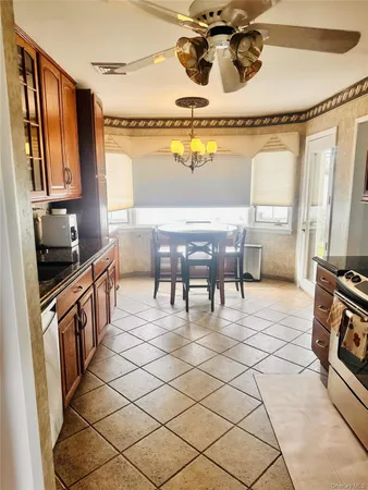 a kitchen with stainless steel appliances granite countertop a sink and cabinets