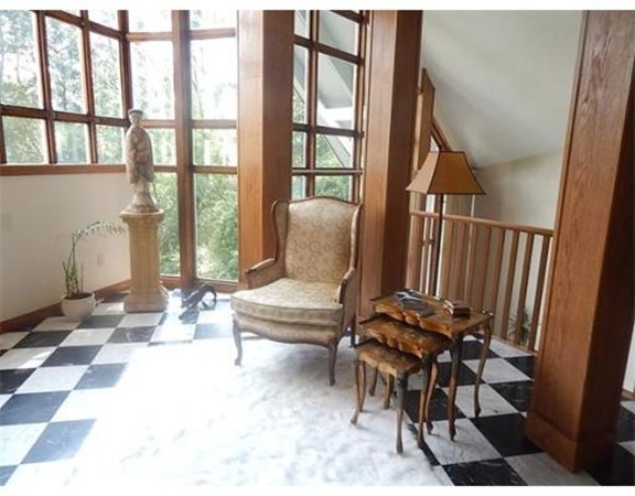 112 Trapelo Road Lincoln, MA 01773 - Photo 11 of 19 a living room with furniture and a floor to ceiling window