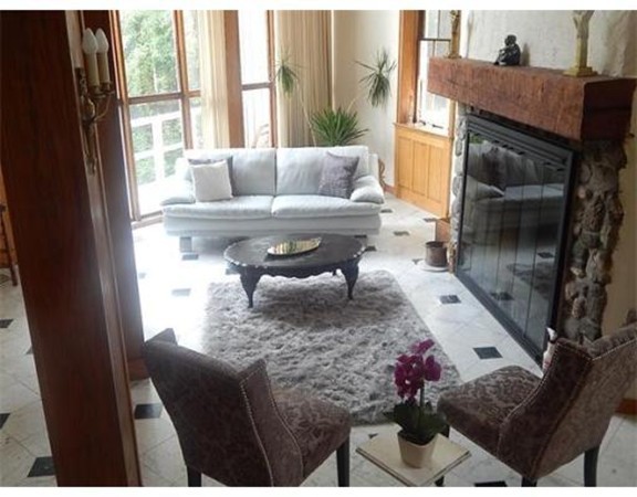112 Trapelo Road Lincoln, MA 01773 - Photo 5 of 19 a living room with furniture and a fireplace