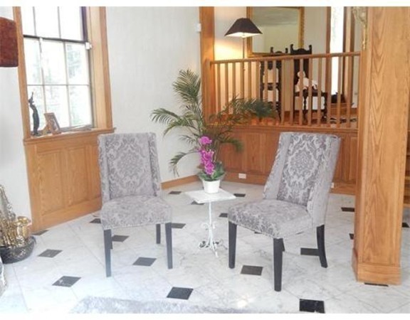 112 Trapelo Road Lincoln, MA 01773 - Photo 8 of 19 a view of a dining room with furniture and a window