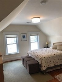 3 Guernsey Street, Unit 3 Boston, MA 02131 - Photo 11 of 23 a bedroom with a bed and a window