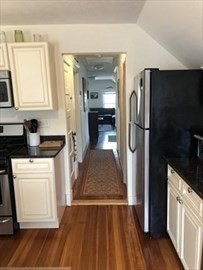 3 Guernsey Street, Unit 3 Boston, MA 02131 - Photo 17 of 23 a kitchen with a refrigerator and cabinets