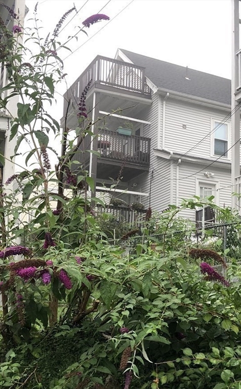 3 Guernsey Street, Unit 3 Boston, MA 02131 - Photo 19 of 23 a sign that is sitting in front of a house