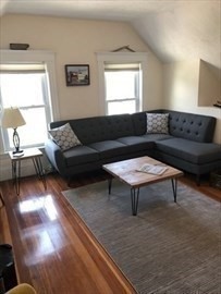 3 Guernsey Street, Unit 3 Boston, MA 02131 - Photo 5 of 23 a living room with furniture and a rug