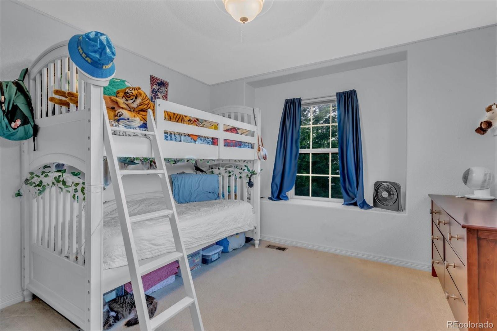4786 Rabbit Mountain Road Broomfield, CO 80020 - Photo 22 of 41 a bedroom with furniture and a window