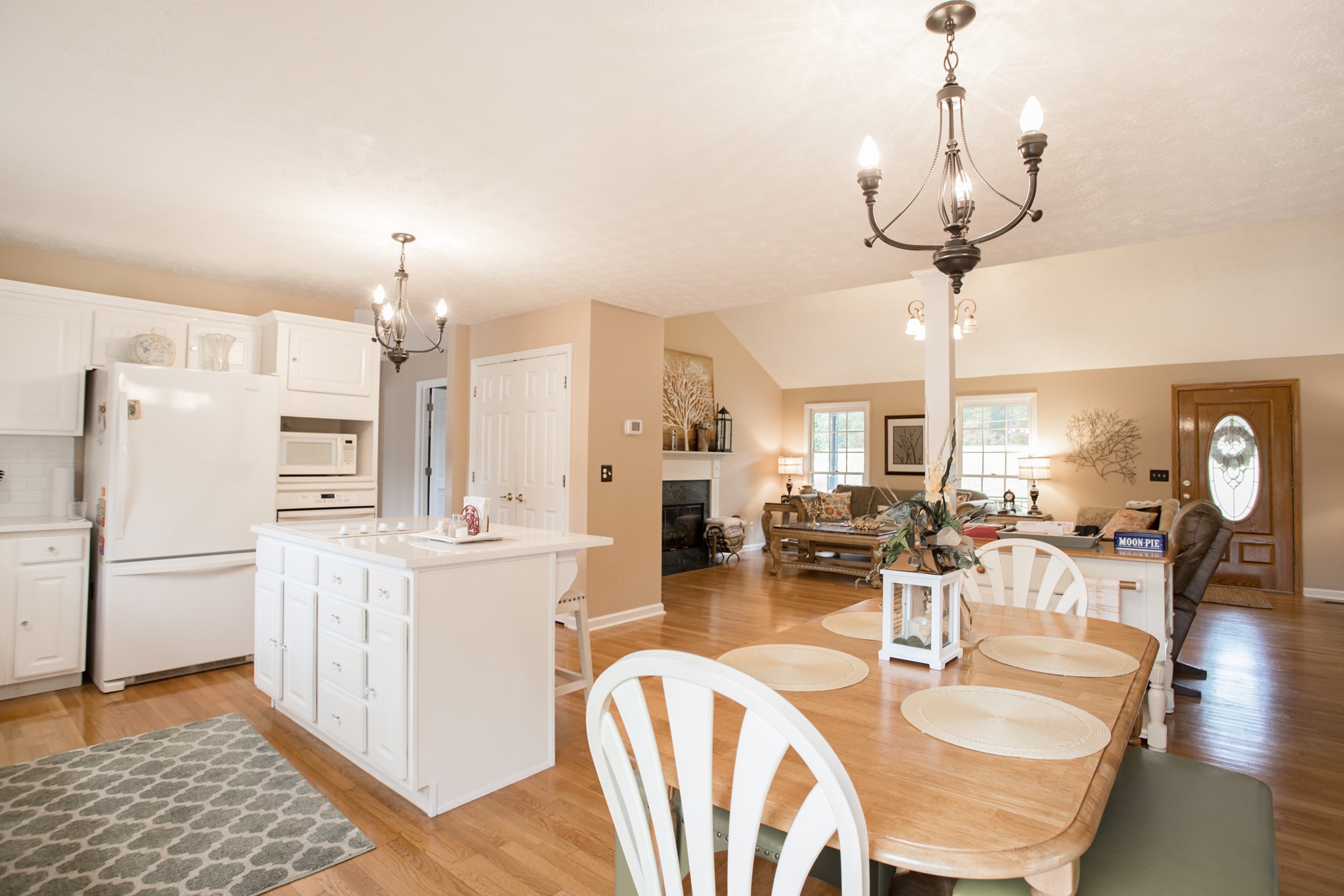 2682 Woods Road Springfield, TN 37172 - Photo 11 of 29 a kitchen with stainless steel appliances kitchen island granite countertop a table chairs and a chandelier