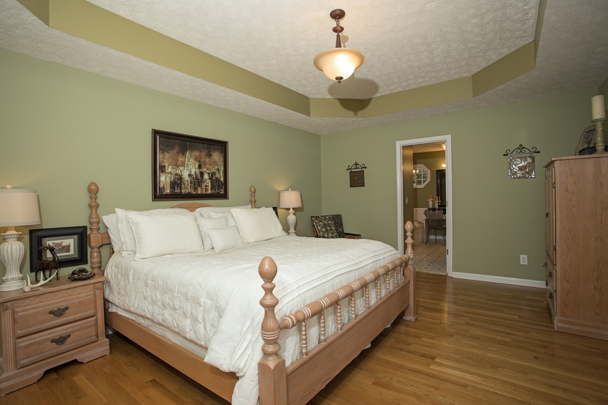 2682 Woods Road Springfield, TN 37172 - Photo 14 of 29 a large bedroom with a bed and wooden floor