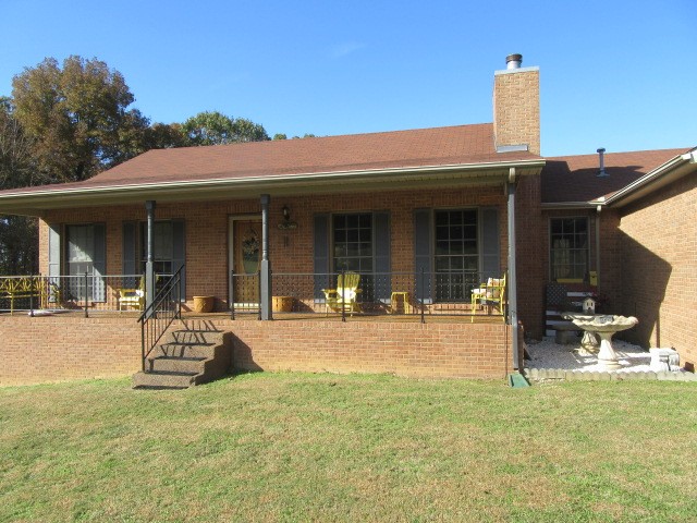 2682 Woods Road Springfield, TN 37172 - Photo 4 of 29 a front view of a house with a garden and patio