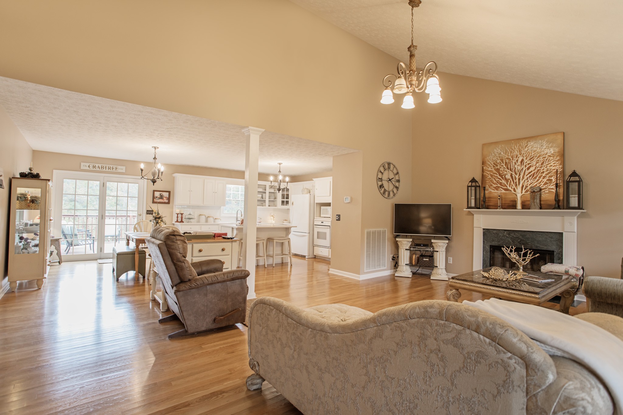 2682 Woods Road Springfield, TN 37172 - Photo 8 of 29 a living room with furniture a fireplace and a chandelier