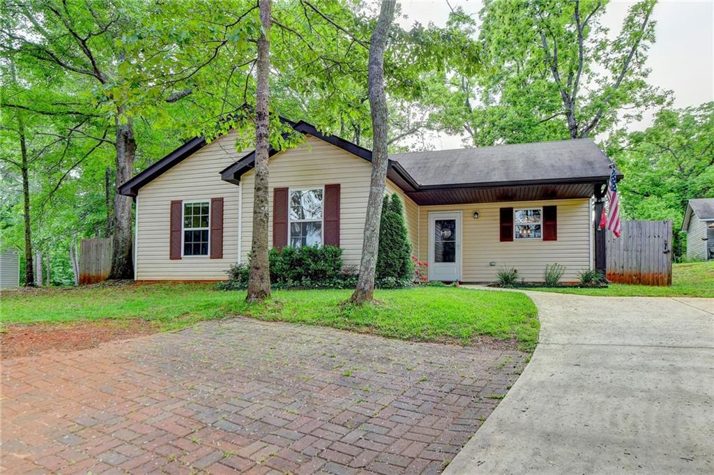 3138 Wallace Road Gainesville, GA 30507 - Photo 1 of 1 a front view of a house with a yard and garage