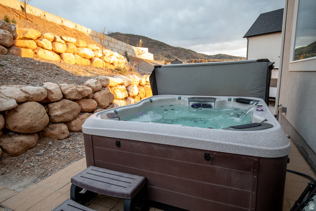 1373 South Raintree Lane Santaquin, UT 84655 - Photo 22 of 29 View of patio with a mountain view and a hot tub