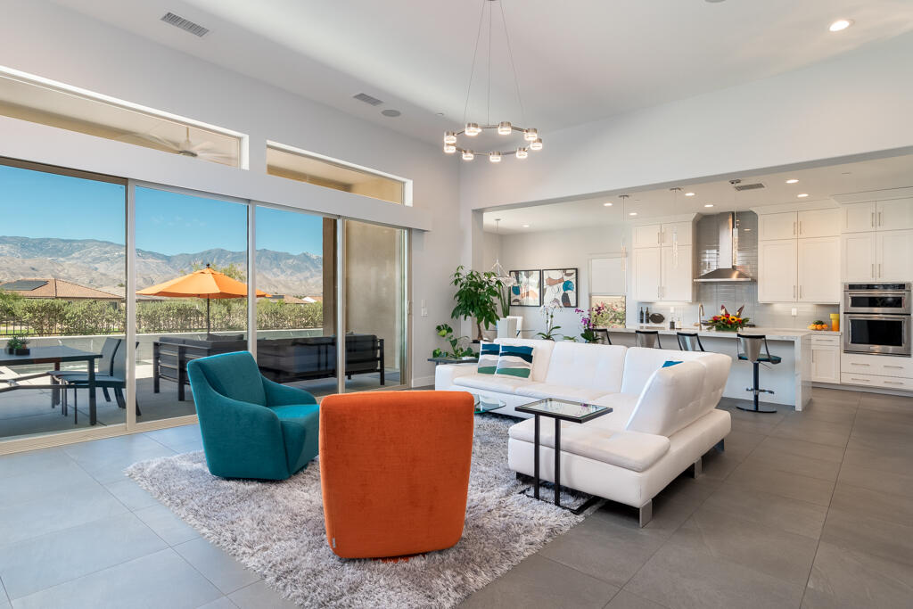 90 Cabernet Rancho Mirage, CA 92270 - Photo 18 of 83 a living room with furniture a chandelier and a view of kitchen