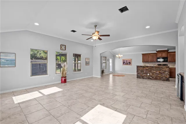a view of a livingroom with a furniture and a ceiling fan