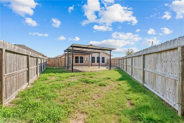 an aerial view of a house with swimming pool