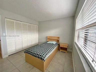 9440 Southwest 8th Street, Unit 202 Boca Raton, FL 33428 - Photo 8 of 20 a view of bedroom with natural light