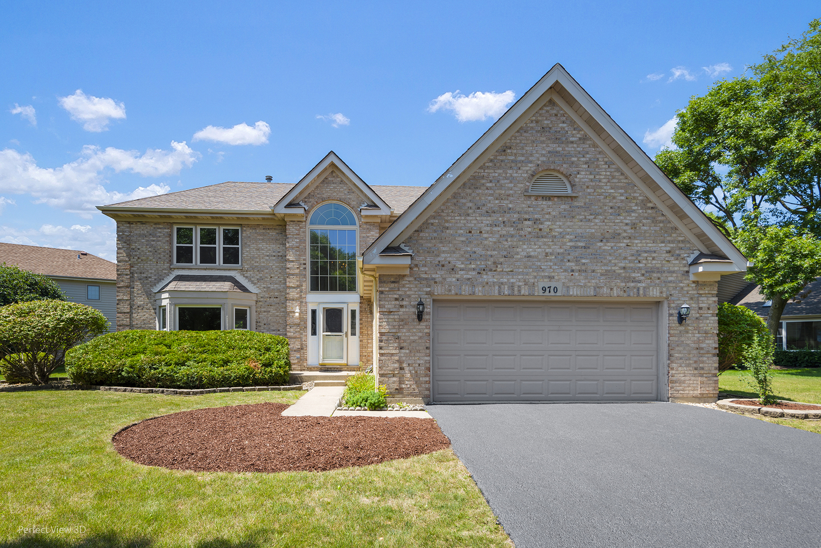 970 Amberwood Circle Naperville, IL 60563 - Photo 1 of 26 a front view of a house with a yard and garage