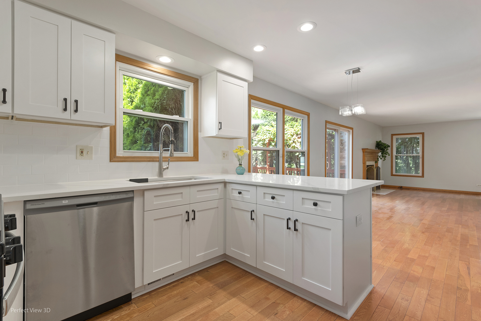 970 Amberwood Circle Naperville, IL 60563 - Photo 11 of 26 a kitchen with sink cabinets and wooden floor