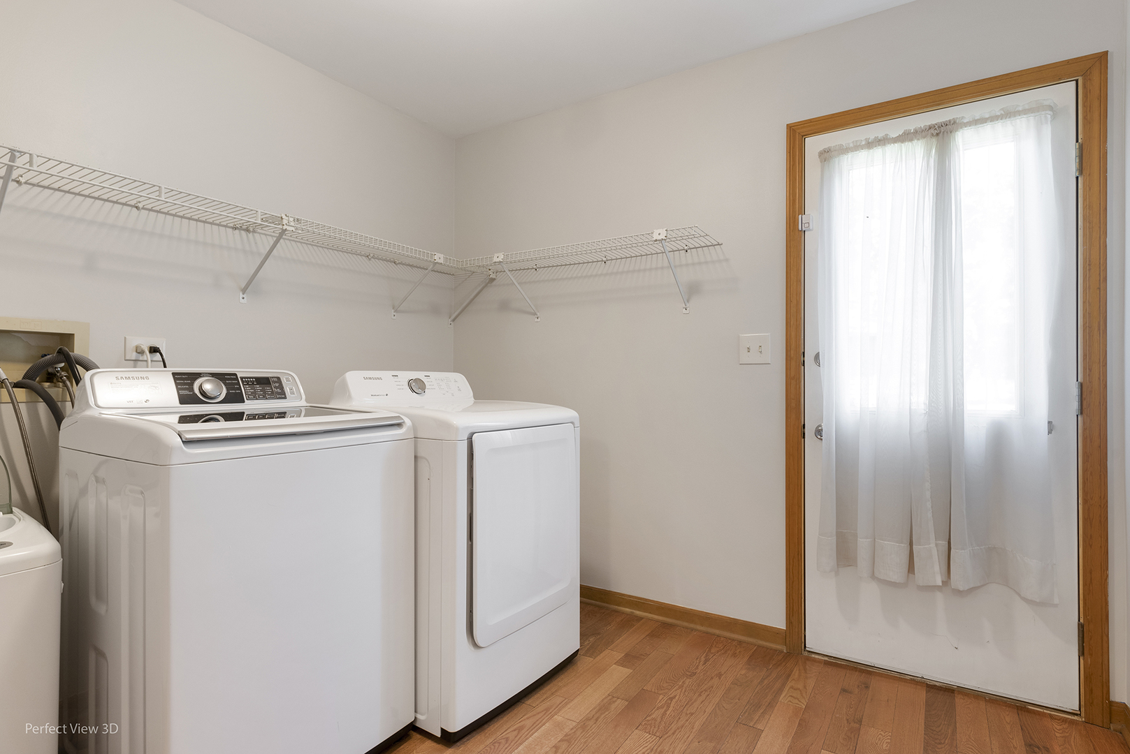 970 Amberwood Circle Naperville, IL 60563 - Photo 24 of 26 a utility room with wooden floor washer and dryer