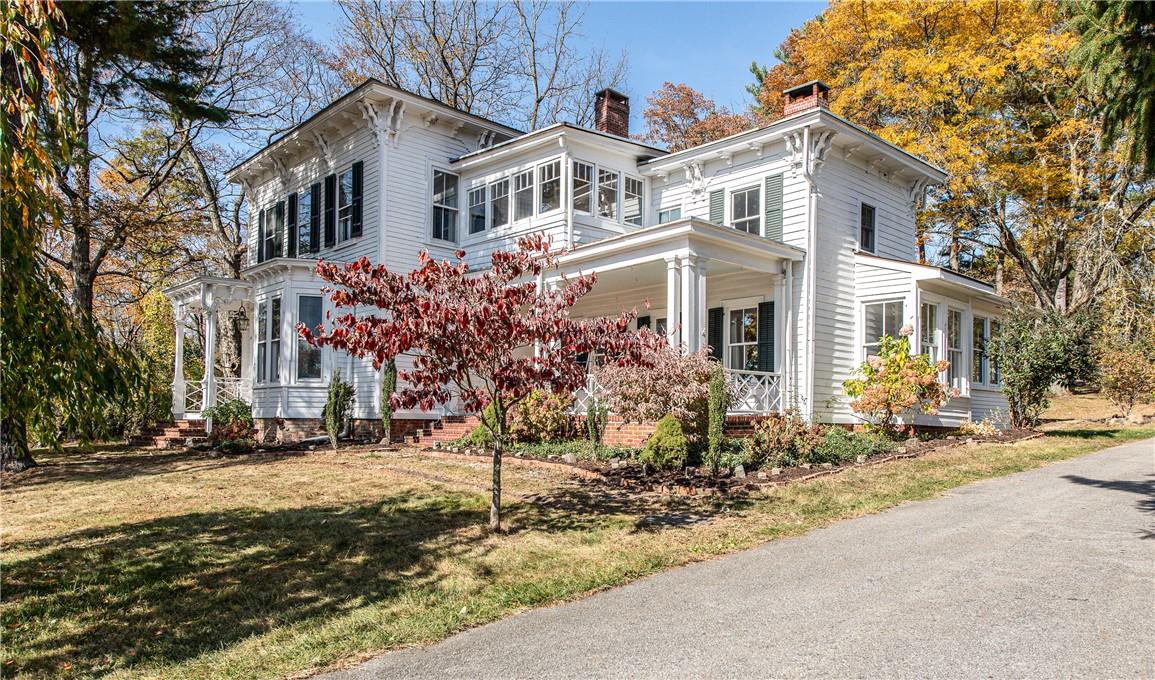 65 Bushwick Road Poughkeepsie, NY 12603 - Photo 1 of 1 View of front of property with a front lawn and a sunroom