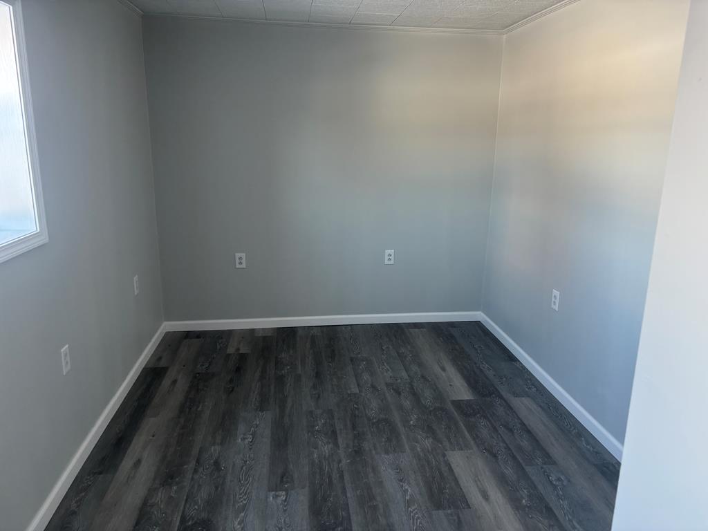 1369 Lawsonham Road, Unit 2 Rimersburg, PA 16248 - Photo 8 of 10 a view of an empty room with wooden floor