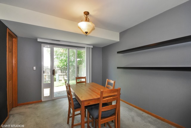 1734 Windcrest Lane Aurora, IL 60504 - Photo 5 of 10 a view of a dining room with furniture and wooden floor