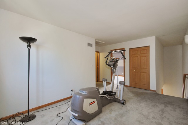 1734 Windcrest Lane Aurora, IL 60504 - Photo 6 of 10 a view of a room with gym equipment