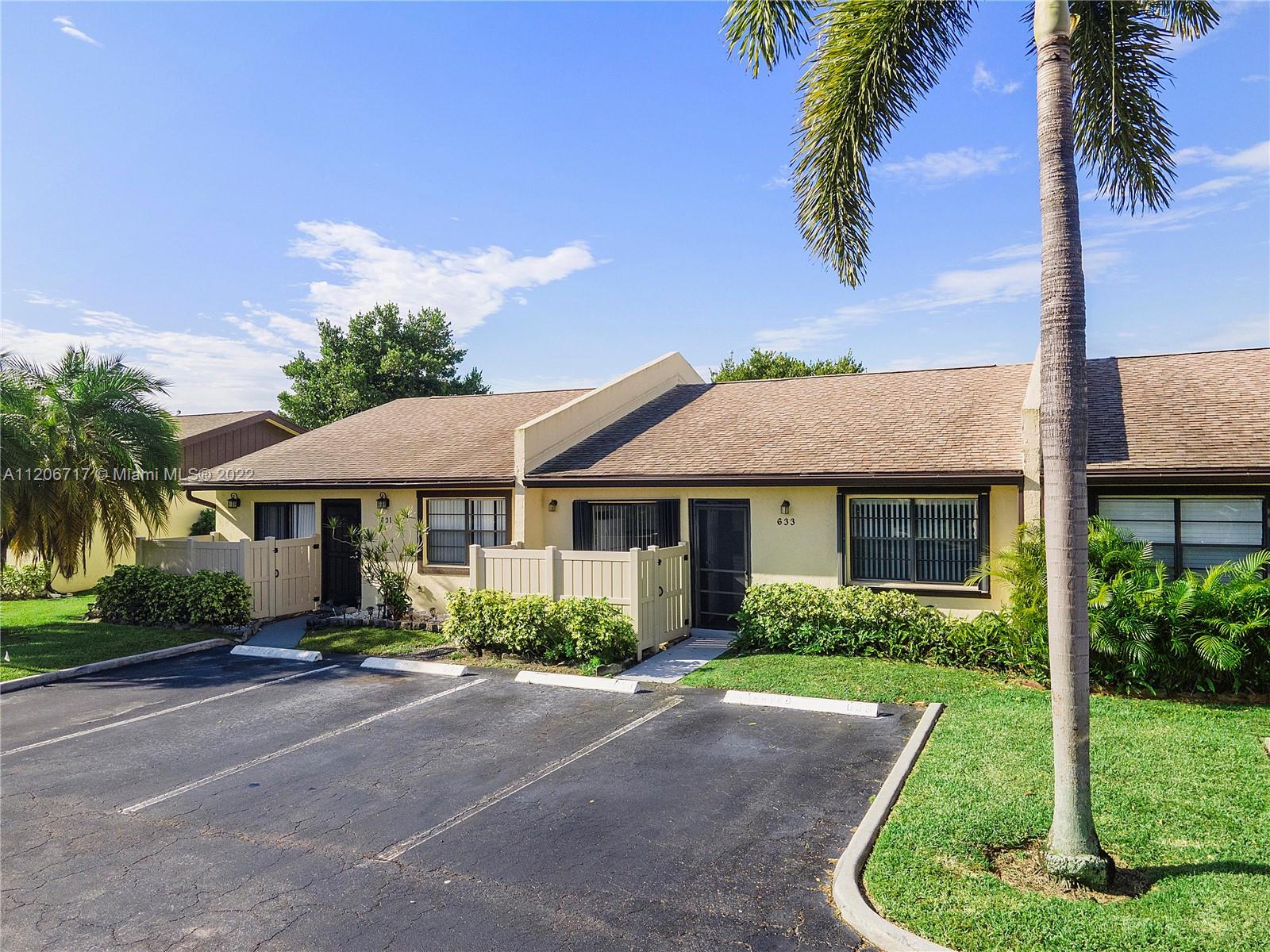 633 Banks Road, Unit 633 Margate, FL 33063 - Photo 1 of 48 a front view of a house with a yard