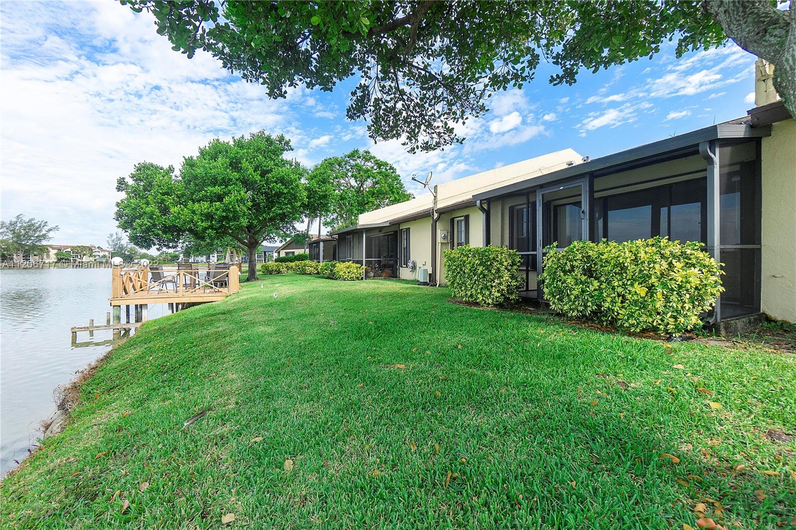 633 Banks Road, Unit 633 Margate, FL 33063 - Photo 45 of 48 a front view of a house with garden