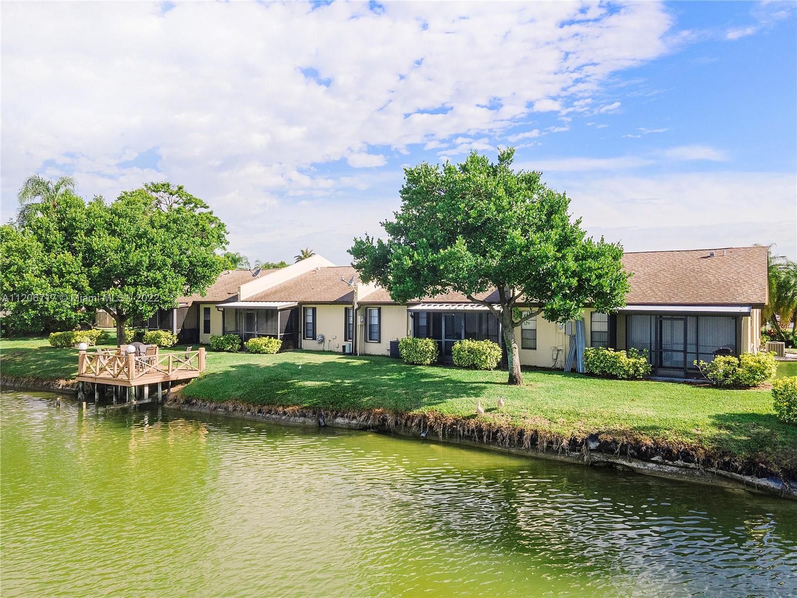 633 Banks Road, Unit 633 Margate, FL 33063 - Photo 48 of 48 a view of a house with swimming pool and a yard
