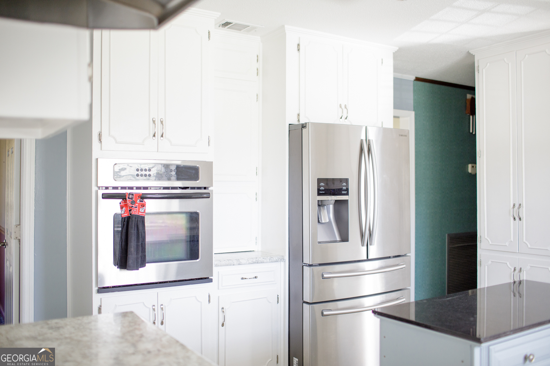 2110 Ware Street Blackshear, GA 31516 - Photo 16 of 57 a kitchen with stainless steel appliances and refrigerator