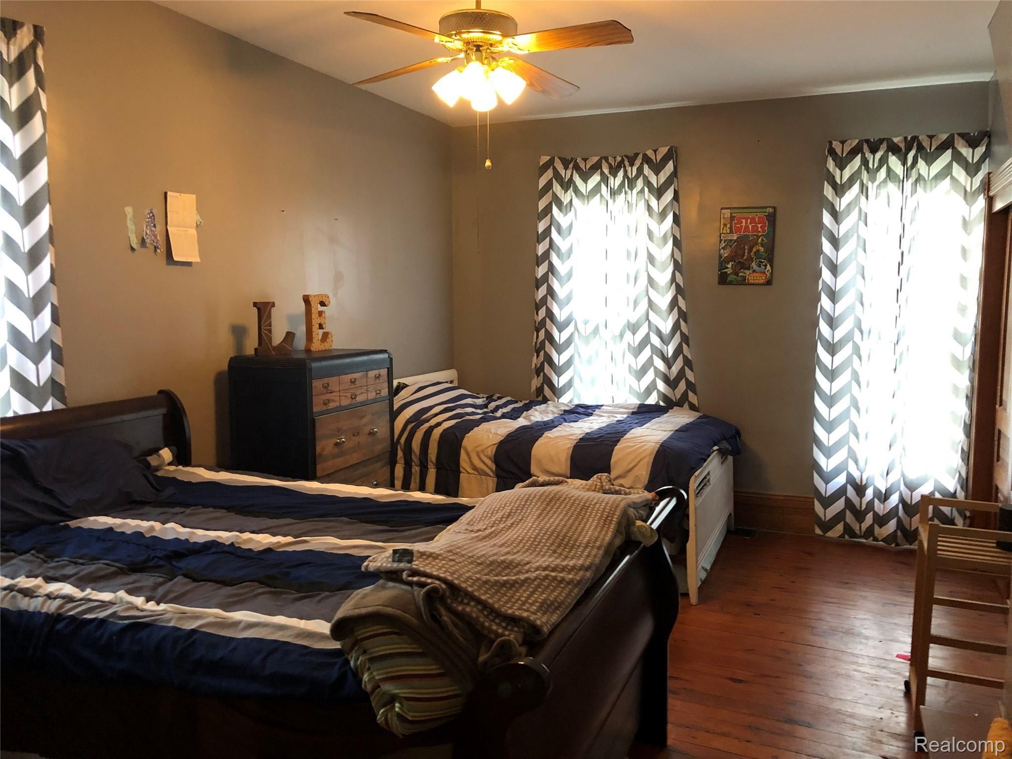 6438 East Bennington Road Durand, MI 48429 - Photo 11 of 27 1st Floor Bedroom! Wood Flooring! Lots Of Room!