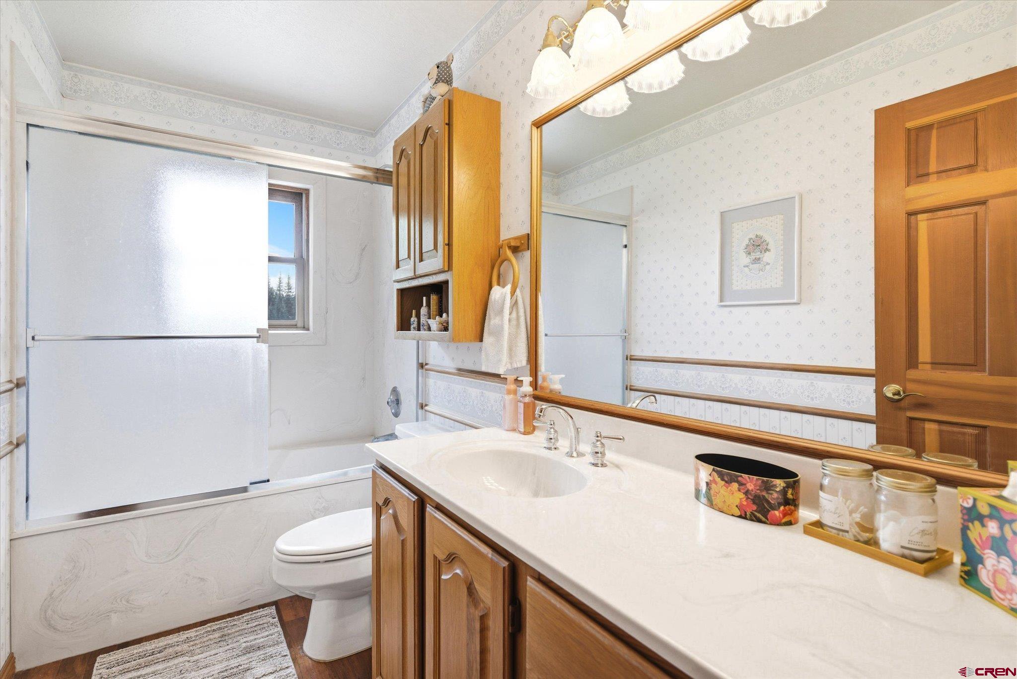 197 Hummingbird Way Bayfield, CO 81122 - Photo 25 of 44 a bathroom with a sink a toilet and shower