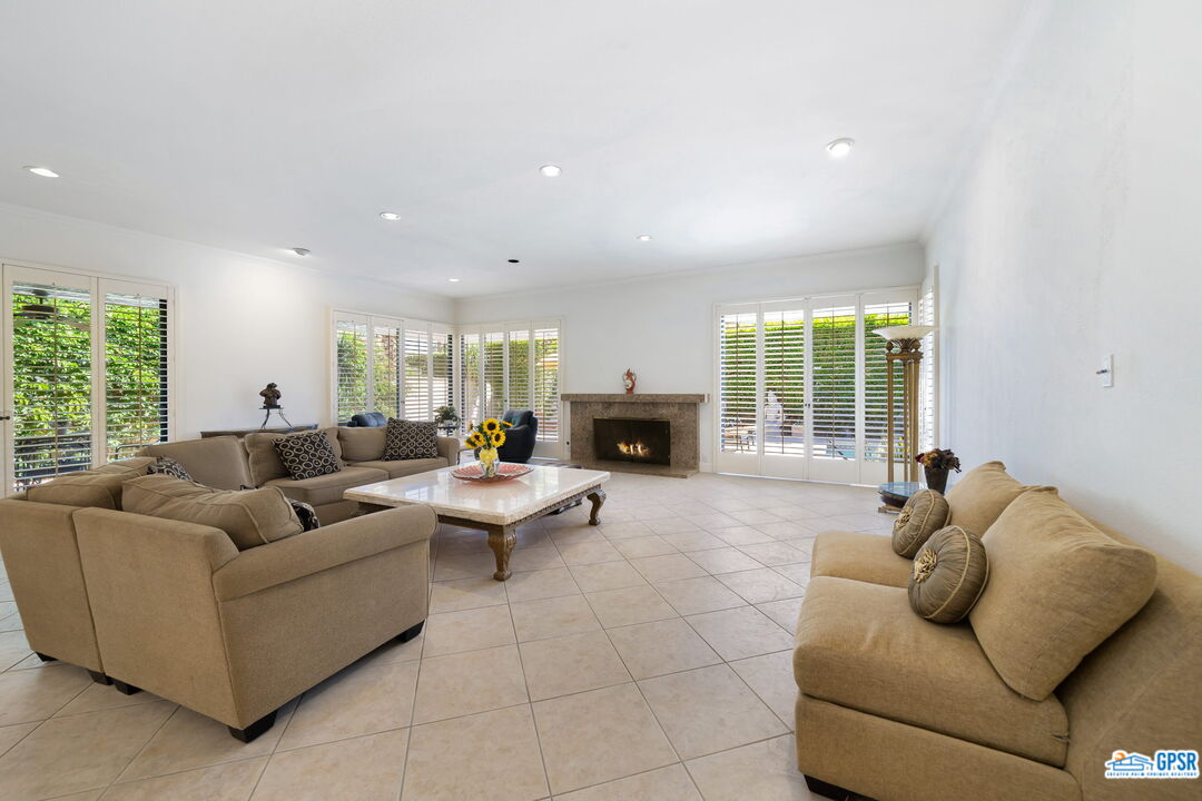 75 Colgate Drive Rancho Mirage, CA 92270 - Photo 12 of 52 a living room with furniture and a fireplace