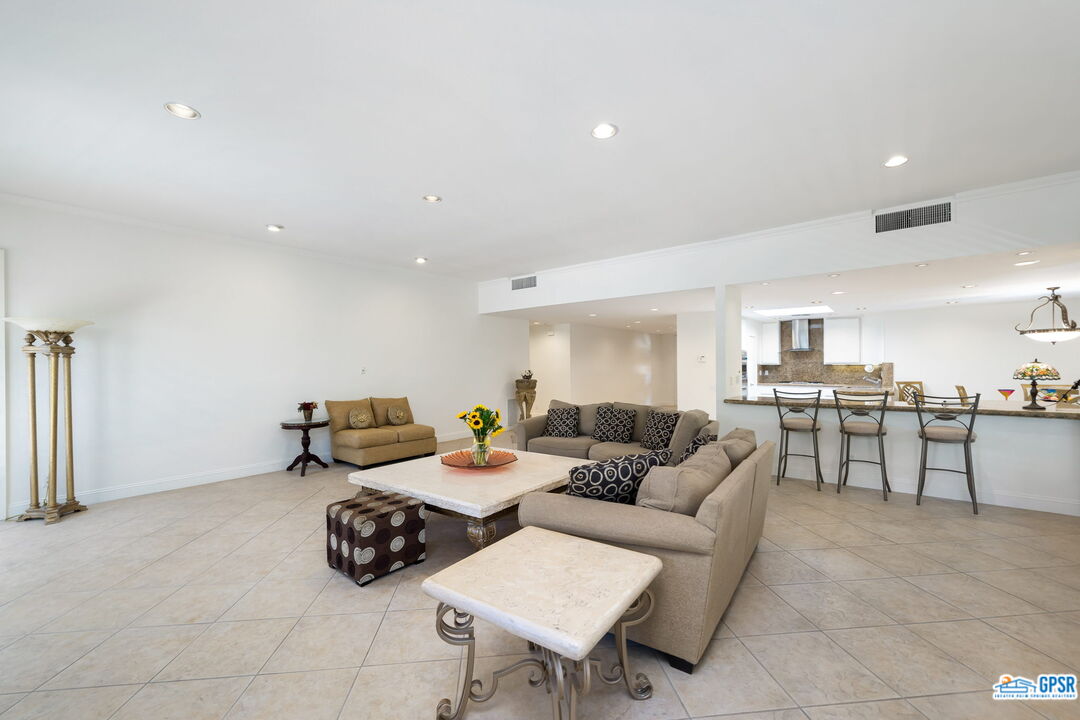 75 Colgate Drive Rancho Mirage, CA 92270 - Photo 15 of 52 a living room with furniture and view of kitchen