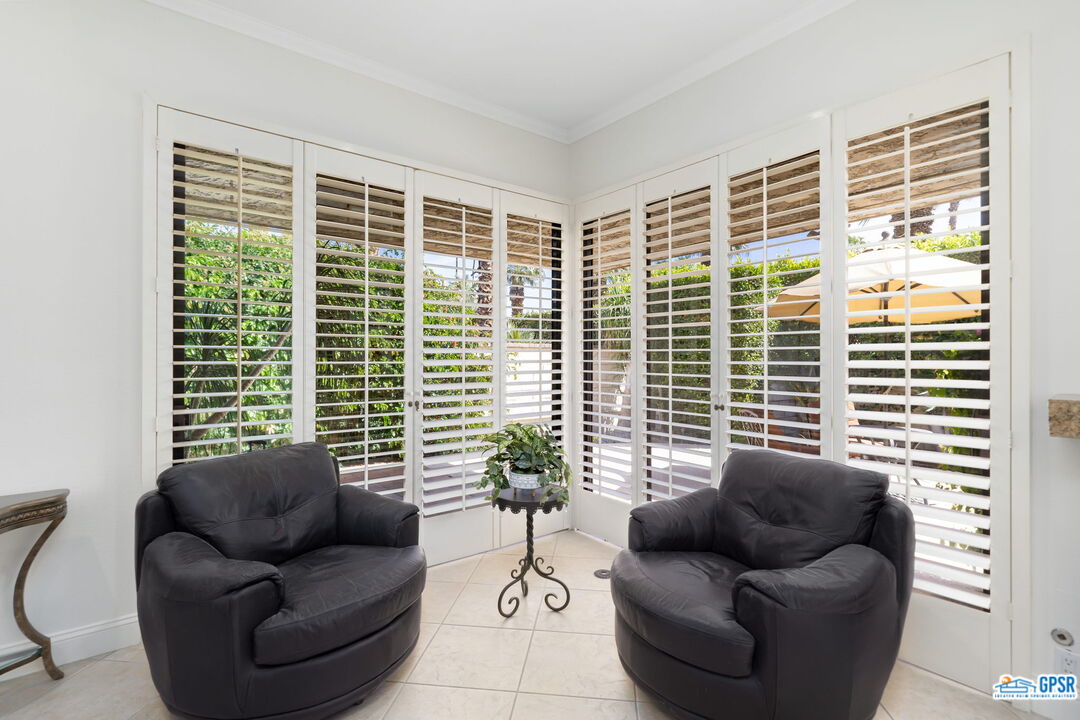 75 Colgate Drive Rancho Mirage, CA 92270 - Photo 17 of 52 a living room with furniture and a large window
