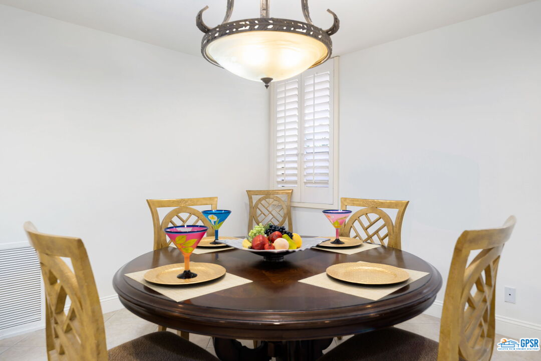 75 Colgate Drive Rancho Mirage, CA 92270 - Photo 20 of 52 a view of a dining room with furniture and window