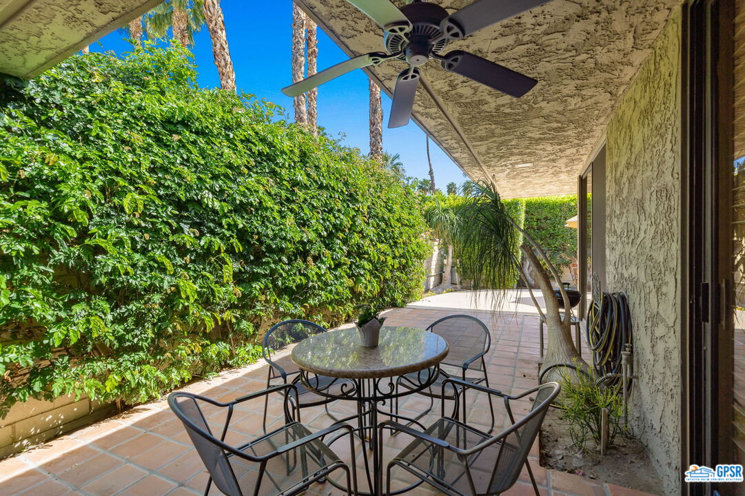 75 Colgate Drive Rancho Mirage, CA 92270 - Photo 26 of 52 a patio with table and chairs and potted plants