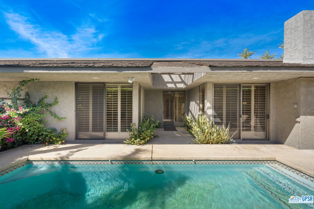 75 Colgate Drive Rancho Mirage, CA 92270 - Photo 33 of 52 front view of a house with a yard
