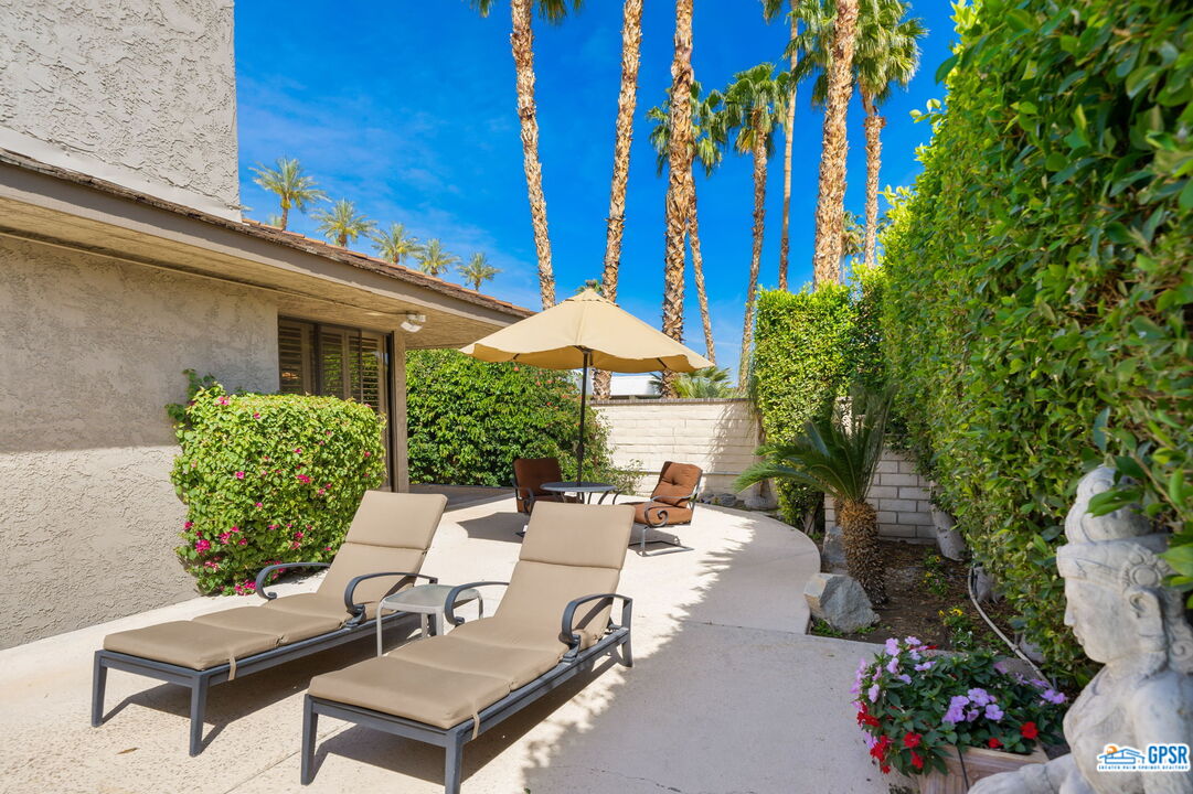75 Colgate Drive Rancho Mirage, CA 92270 - Photo 34 of 52 a view of a patio with couches table and chairs and potted plants
