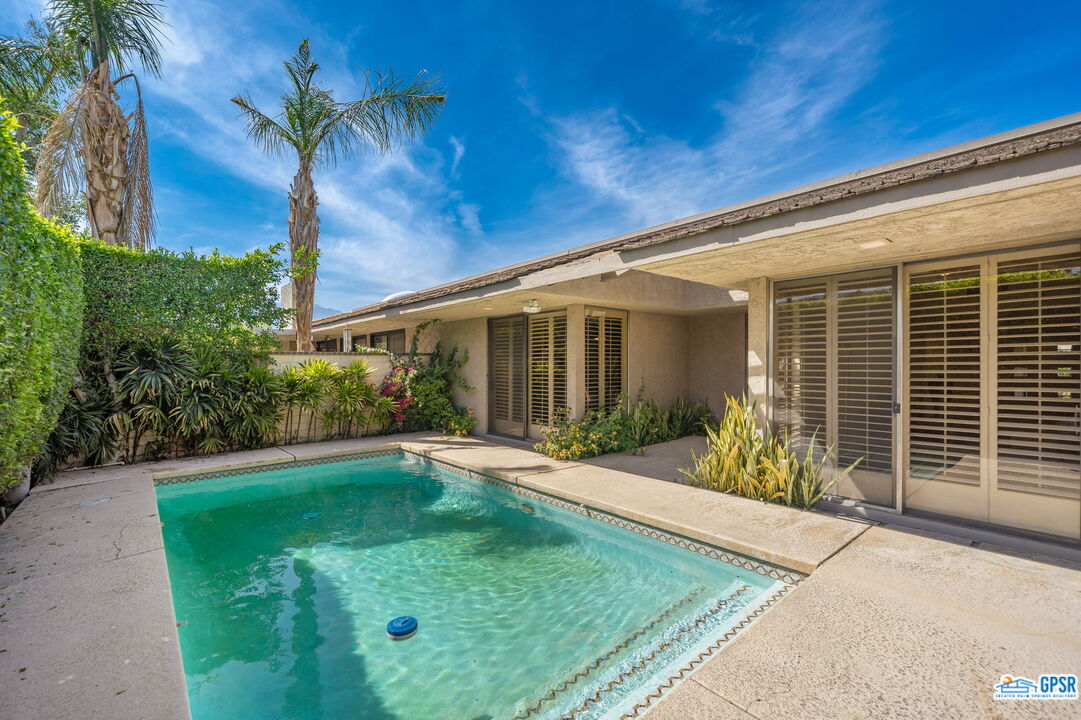 75 Colgate Drive Rancho Mirage, CA 92270 - Photo 35 of 52 a front view of a house with garden