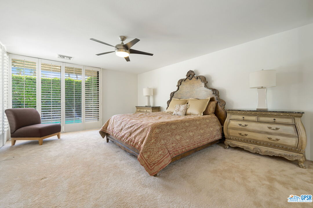 75 Colgate Drive Rancho Mirage, CA 92270 - Photo 36 of 52 a spacious bedroom with a bed and a couch