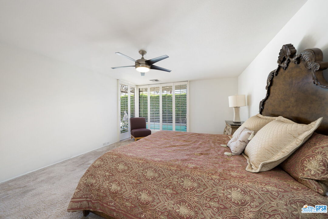 75 Colgate Drive Rancho Mirage, CA 92270 - Photo 37 of 52 a bedroom with a bed and window
