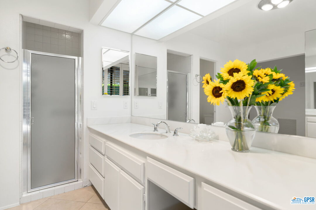 75 Colgate Drive Rancho Mirage, CA 92270 - Photo 39 of 52 a bathroom with a sink and a mirror